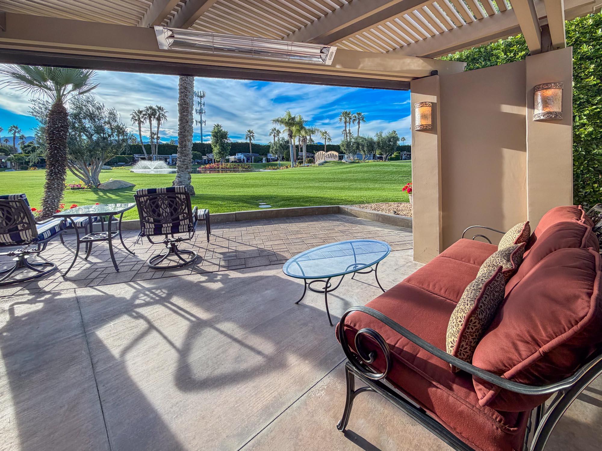 80394 Ave 48, Unit 298 Indio, CA 92201 - Photo 8 of 25 a backyard of a house with outdoor seating