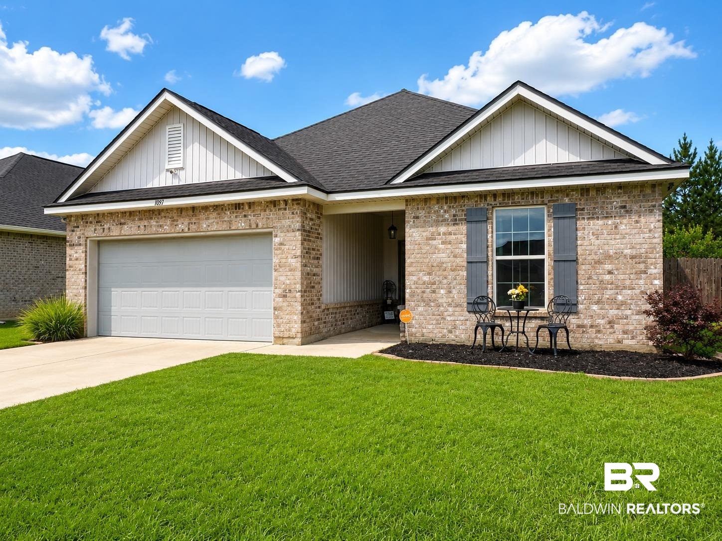 1097 Stella Road Foley, AL 36535 - Photo 3 of 15 Brick exterior featuring a dark asphalt shingle roof