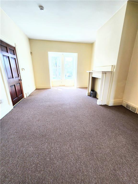 613 Ivy Street, Unit 1 Pittsburgh, PA 15232 - Photo 2 of 6 a view of a room with an empty room