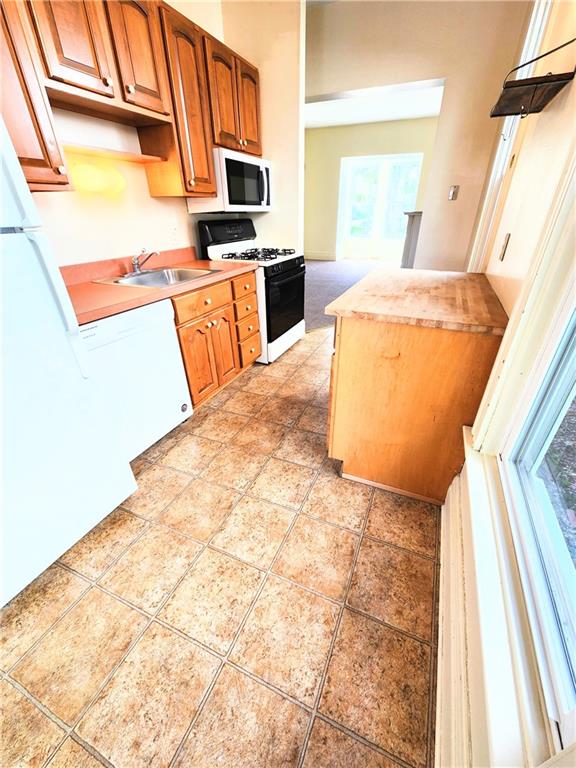 613 Ivy Street, Unit 1 Pittsburgh, PA 15232 - Photo 3 of 6 a kitchen with a sink appliances and cabinets