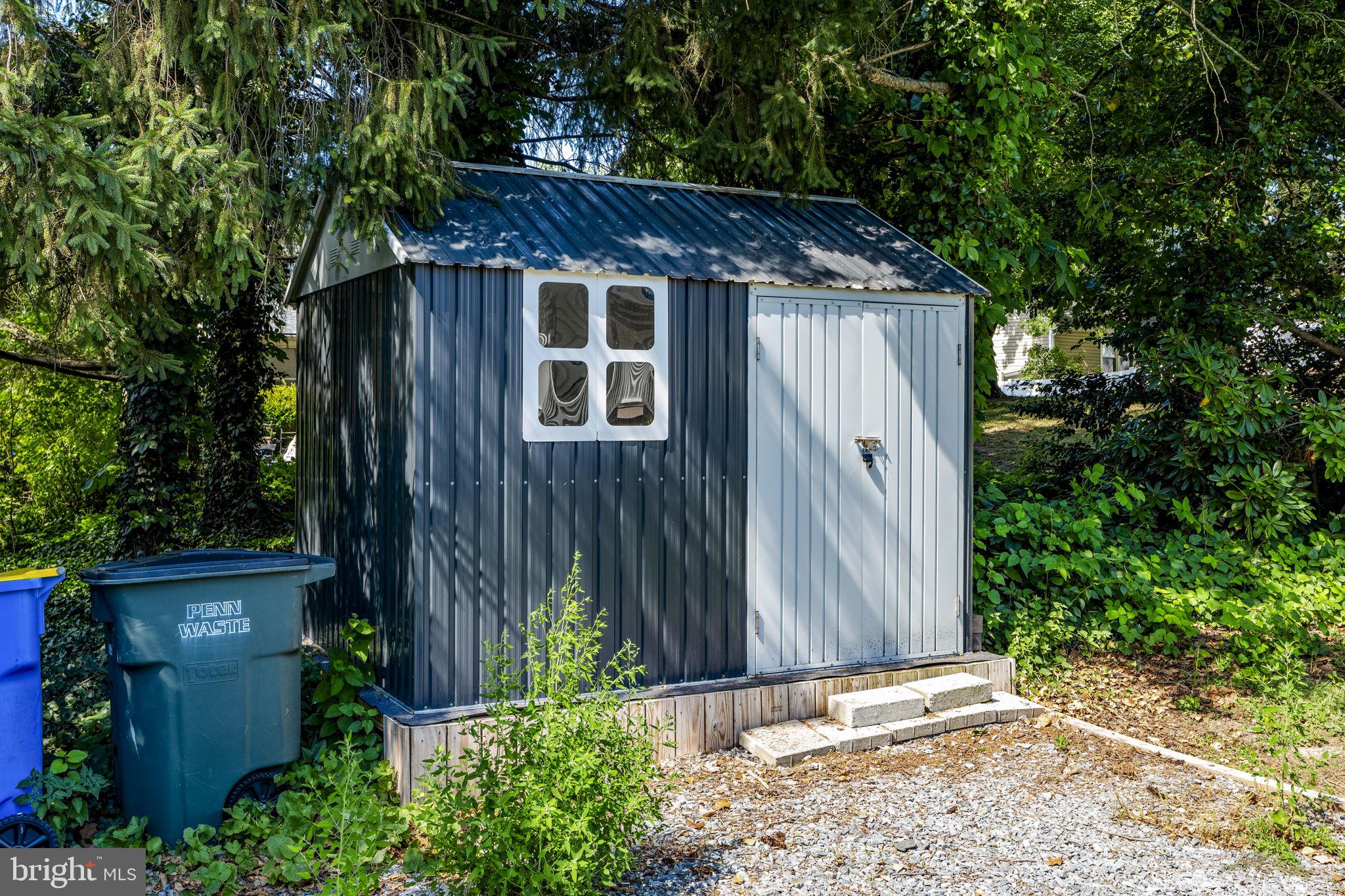 4107 Trowbridge Road York, PA 17402 - Photo 47 of 50 Charming garden shed in lush greenery.