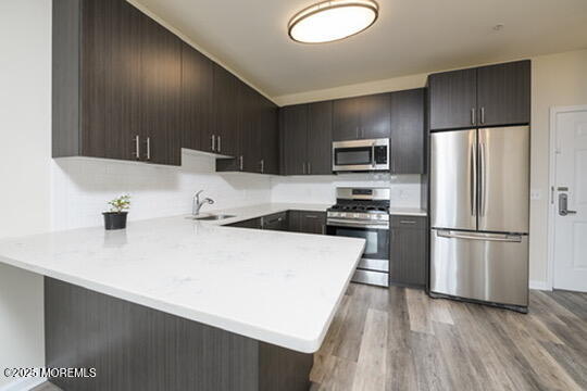 2 Henessey Boulevard, Unit 304 Atlantic Highlands, NJ 07716 - Photo 11 of 19 a kitchen with a refrigerator a stove and a sink