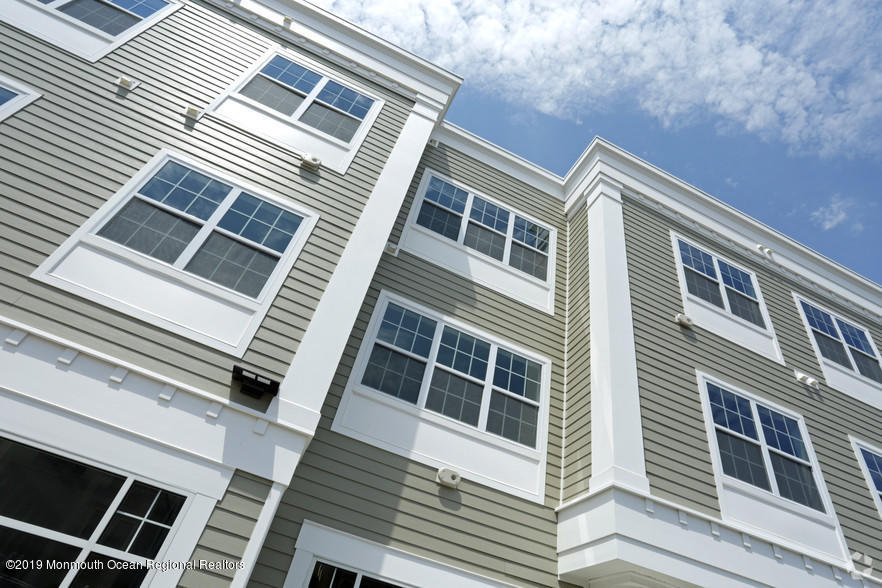 2 Henessey Boulevard, Unit 304 Atlantic Highlands, NJ 07716 - Photo 2 of 19 a front view of a building