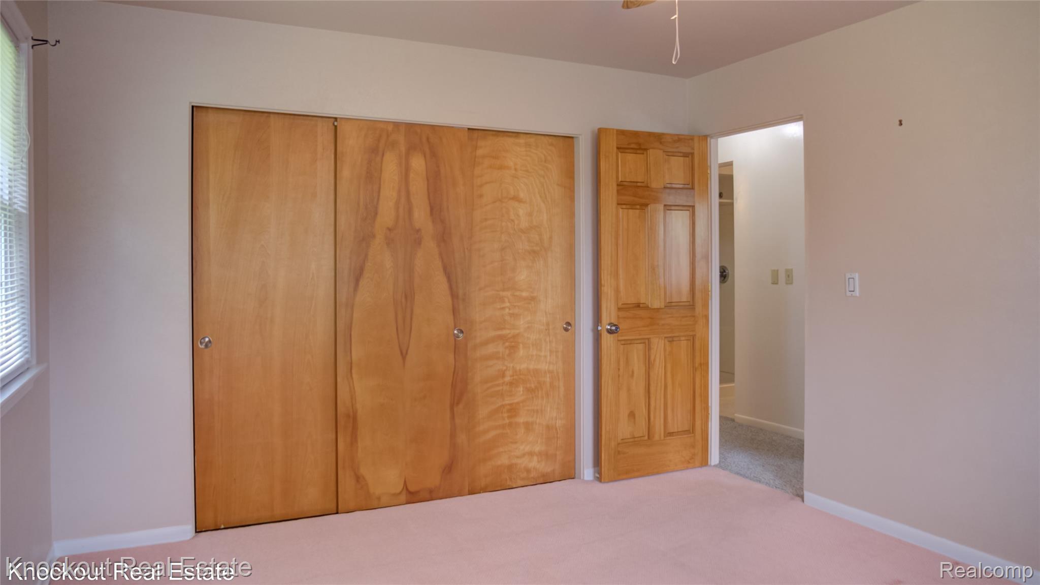 4465 Dirker Road Saginaw, MI 48638 - Photo 26 of 56 Unfurnished bedroom with a closet and light carpet