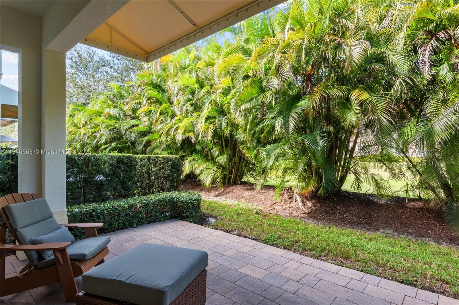 22936 Clear Echo Drive, Unit 34 Boca Raton, FL 33433 - Photo 13 of 41 a view of a backyard with plants and a patio