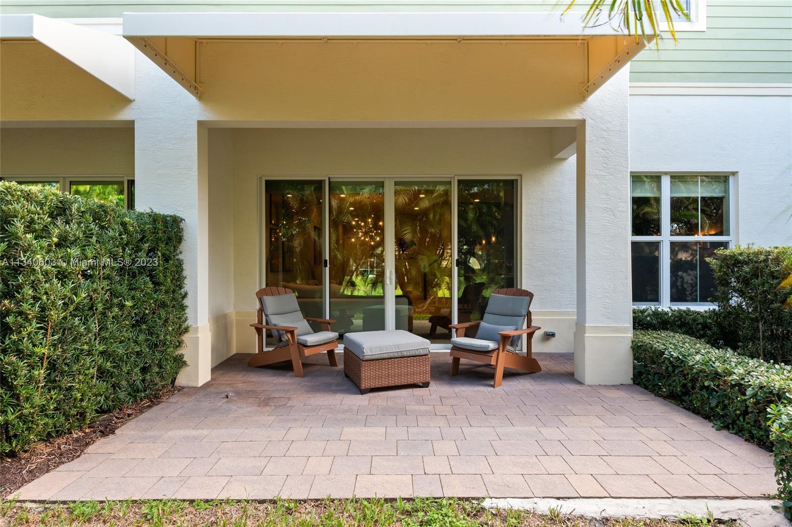 22936 Clear Echo Drive, Unit 34 Boca Raton, FL 33433 - Photo 15 of 41 a building outdoor space with patio furniture and potted plants