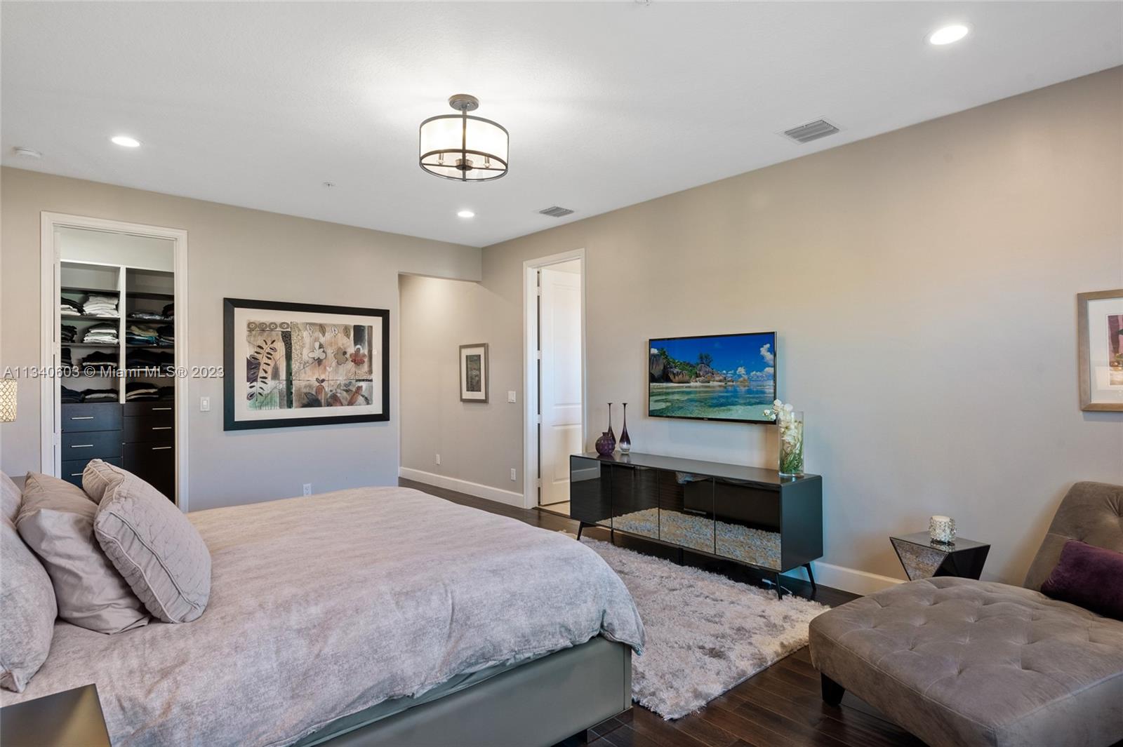 22936 Clear Echo Drive, Unit 34 Boca Raton, FL 33433 - Photo 20 of 41 a bedroom with a bed and a painting on the wall