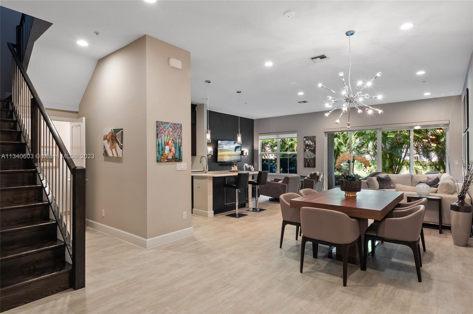 22936 Clear Echo Drive, Unit 34 Boca Raton, FL 33433 - Photo 2 of 41 a view of a dining area with furniture window and wooden floor