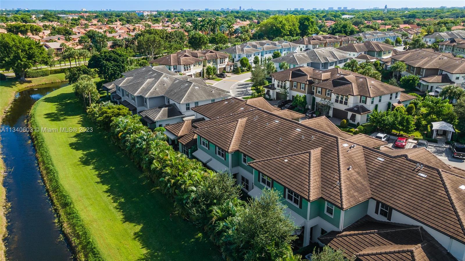 22936 Clear Echo Drive, Unit 34 Boca Raton, FL 33433 - Photo 35 of 41 an aerial view of multiple houses with yard