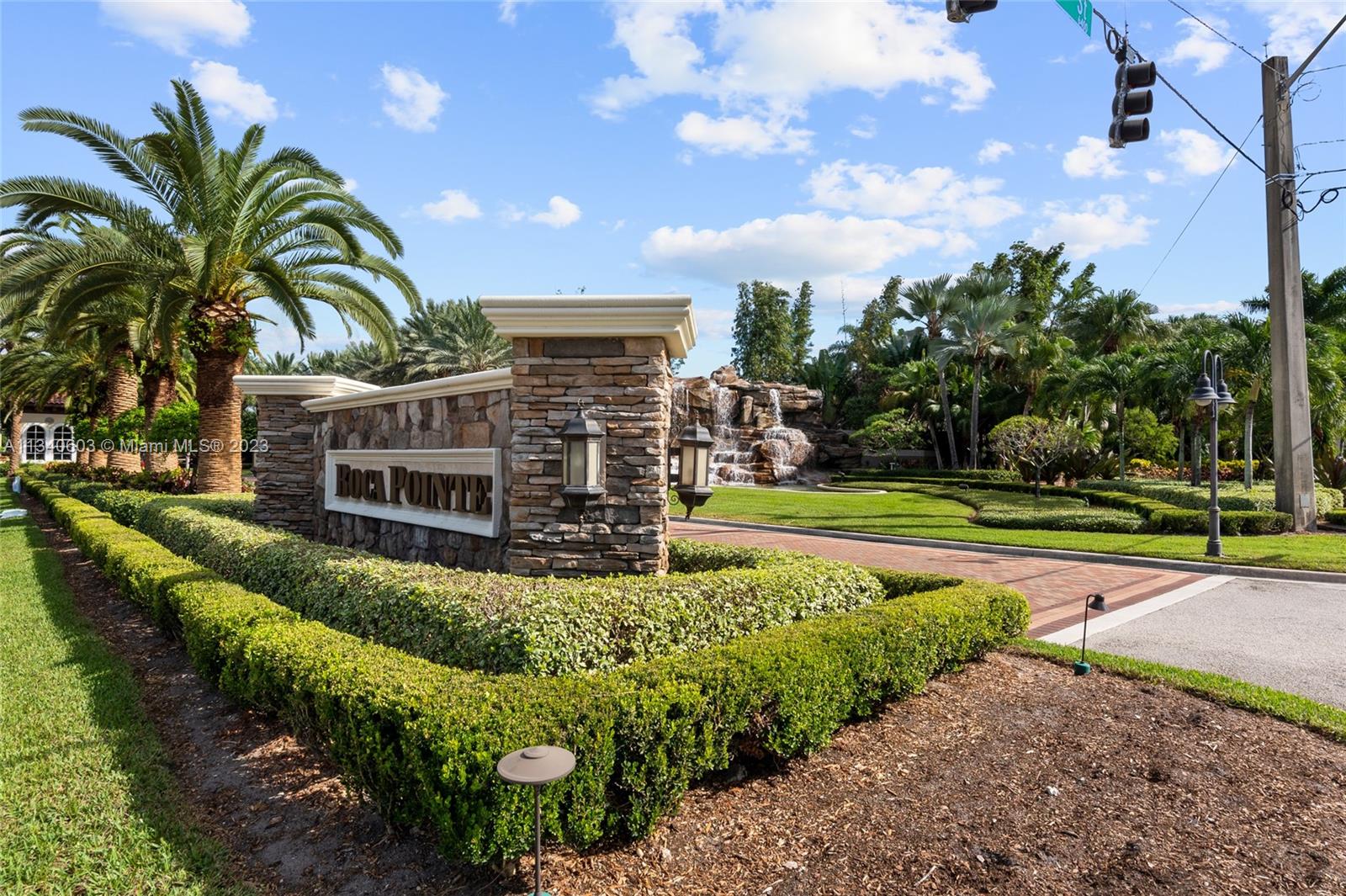 22936 Clear Echo Drive, Unit 34 Boca Raton, FL 33433 - Photo 37 of 41 a view of a garden with tall buildings