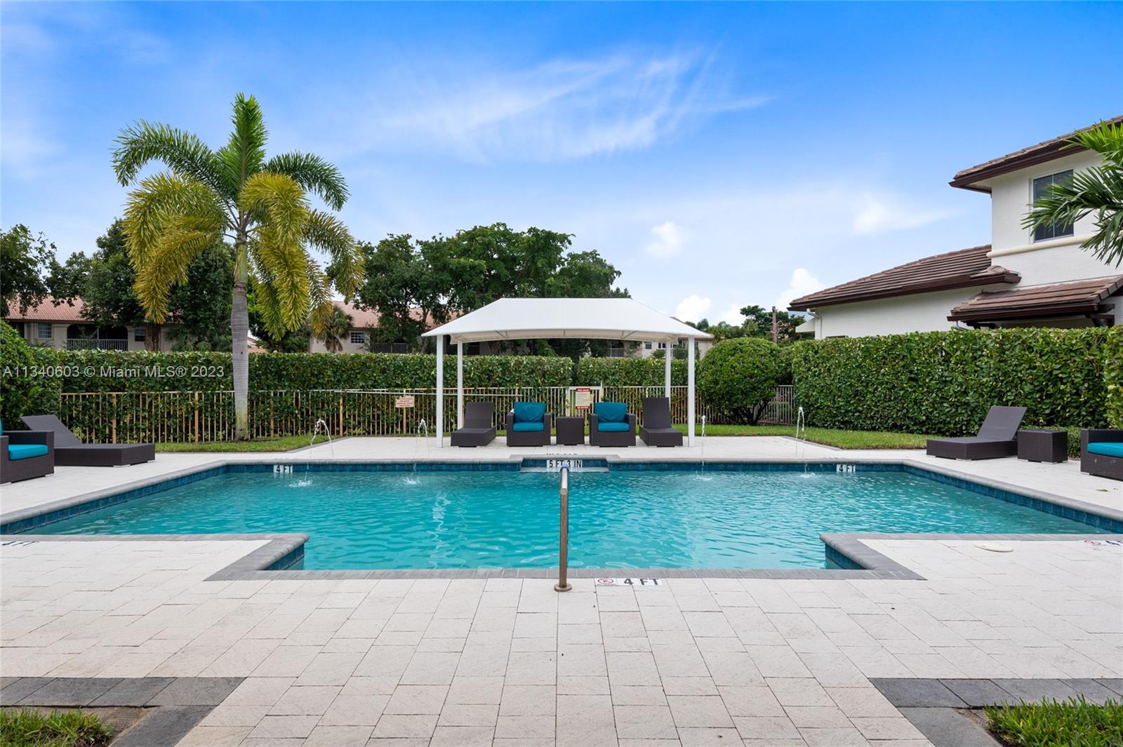 22936 Clear Echo Drive, Unit 34 Boca Raton, FL 33433 - Photo 39 of 41 a view of a swimming pool with a patio