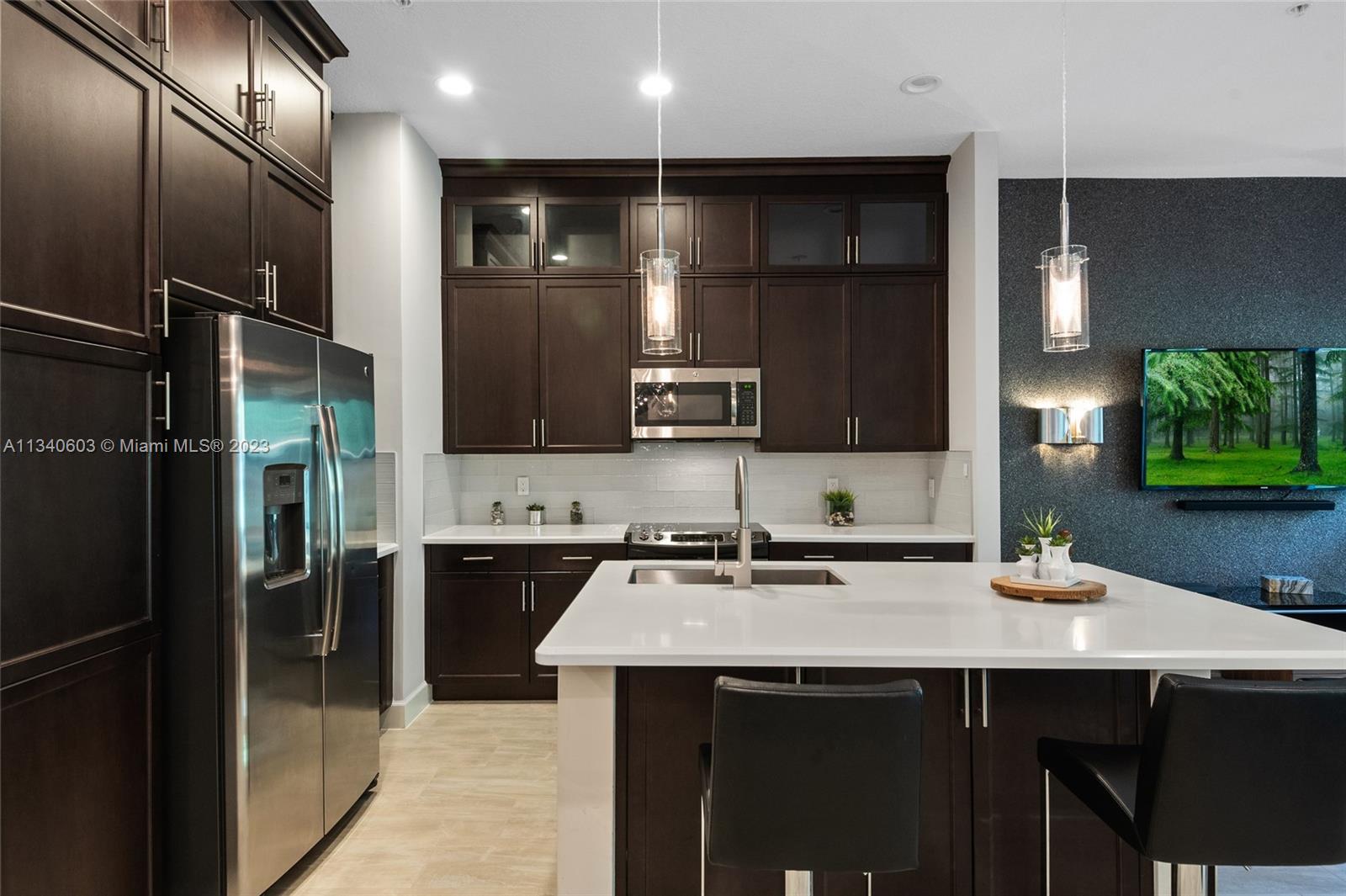 22936 Clear Echo Drive, Unit 34 Boca Raton, FL 33433 - Photo 4 of 41 a kitchen with a sink and cabinets