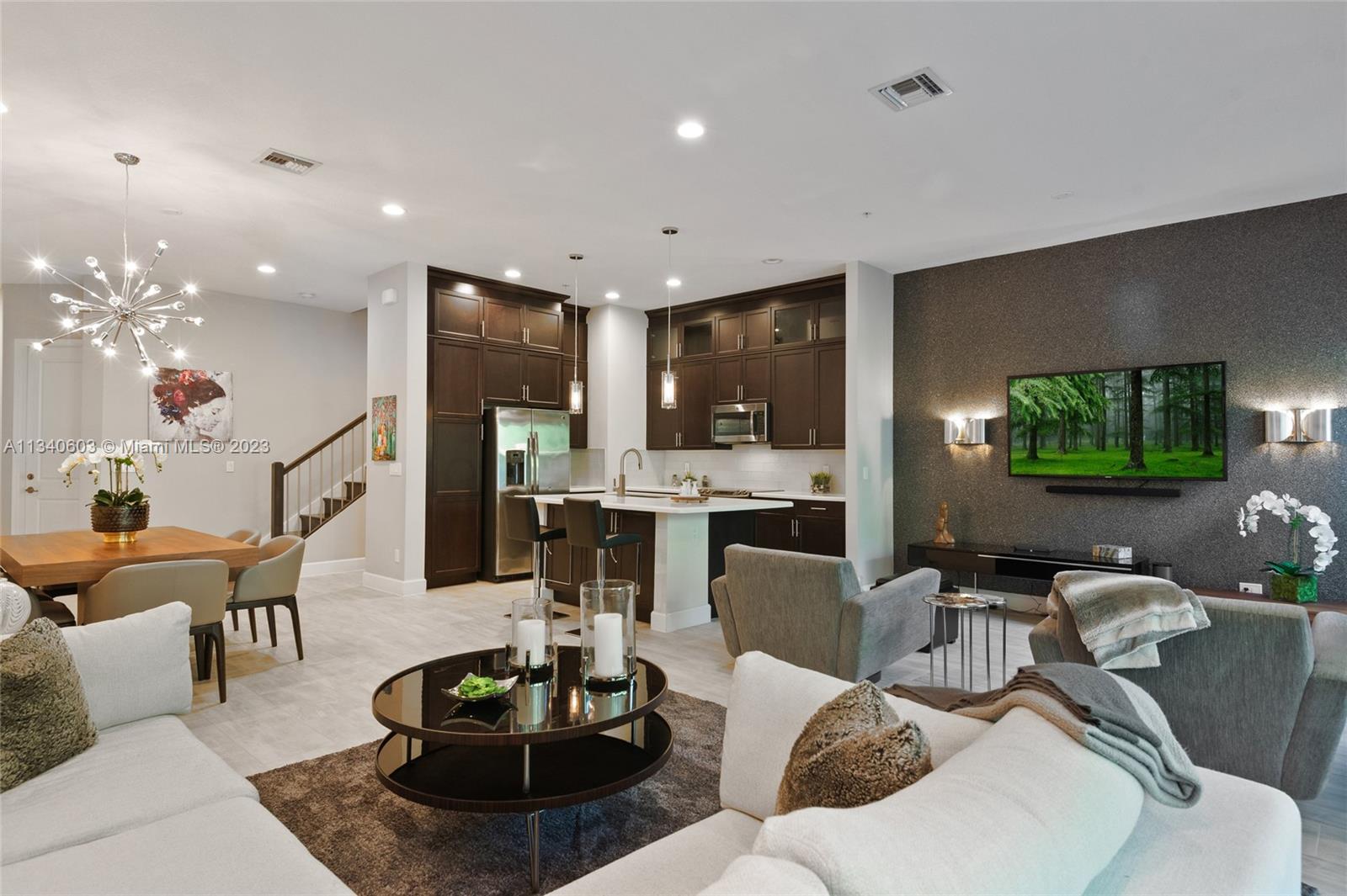 22936 Clear Echo Drive, Unit 34 Boca Raton, FL 33433 - Photo 9 of 41 a living room with furniture and a flat screen tv