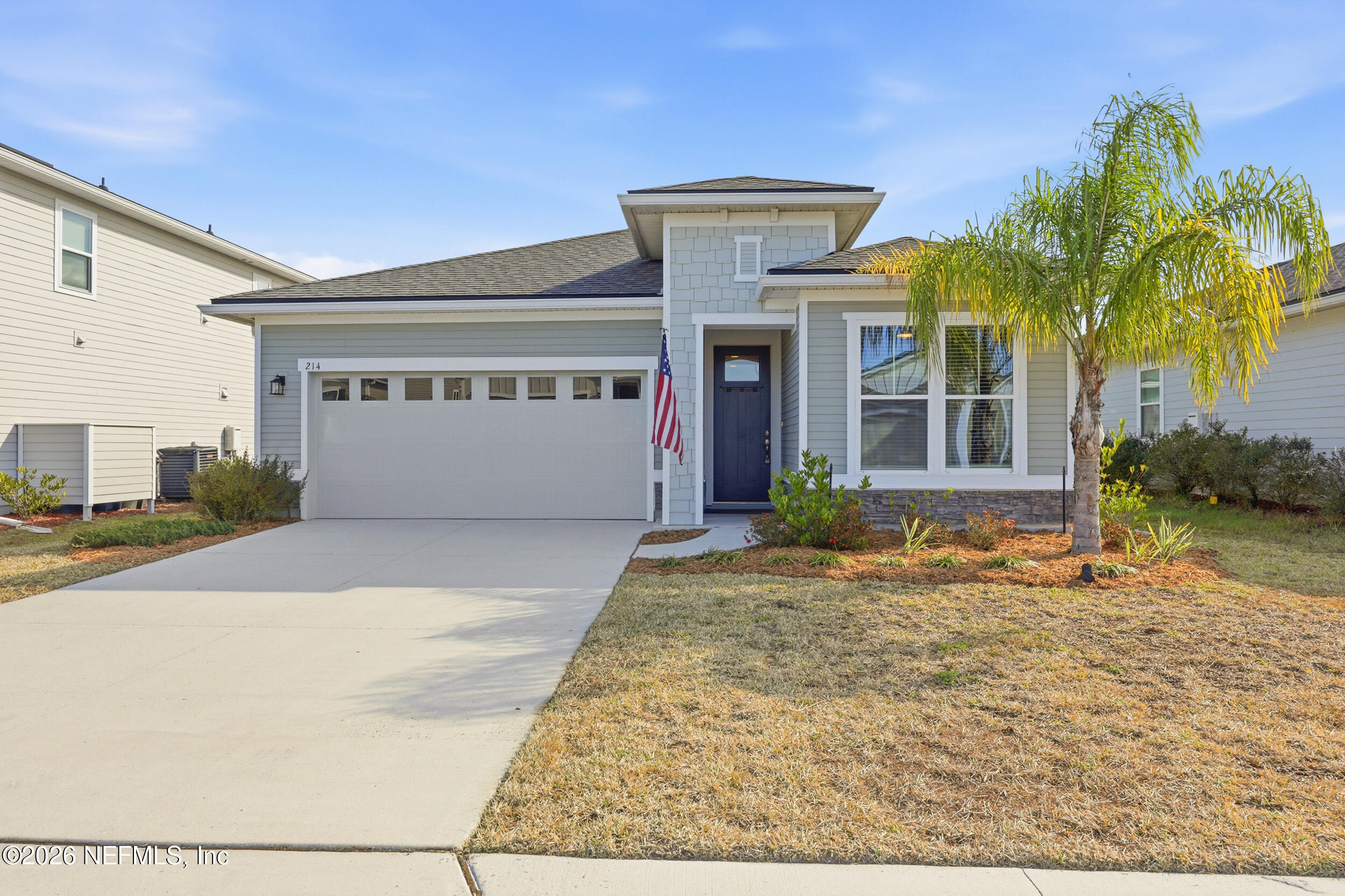 214 Pepperpike Way St. Augustine, FL 32092 - Photo 18 of 63 a front view of a house with a yard and garage