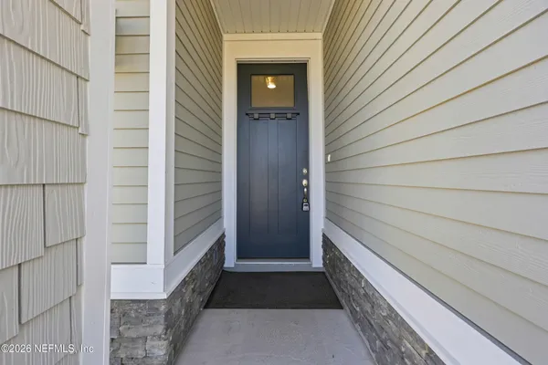 a bathroom with a sink double vanity granite and a mirror