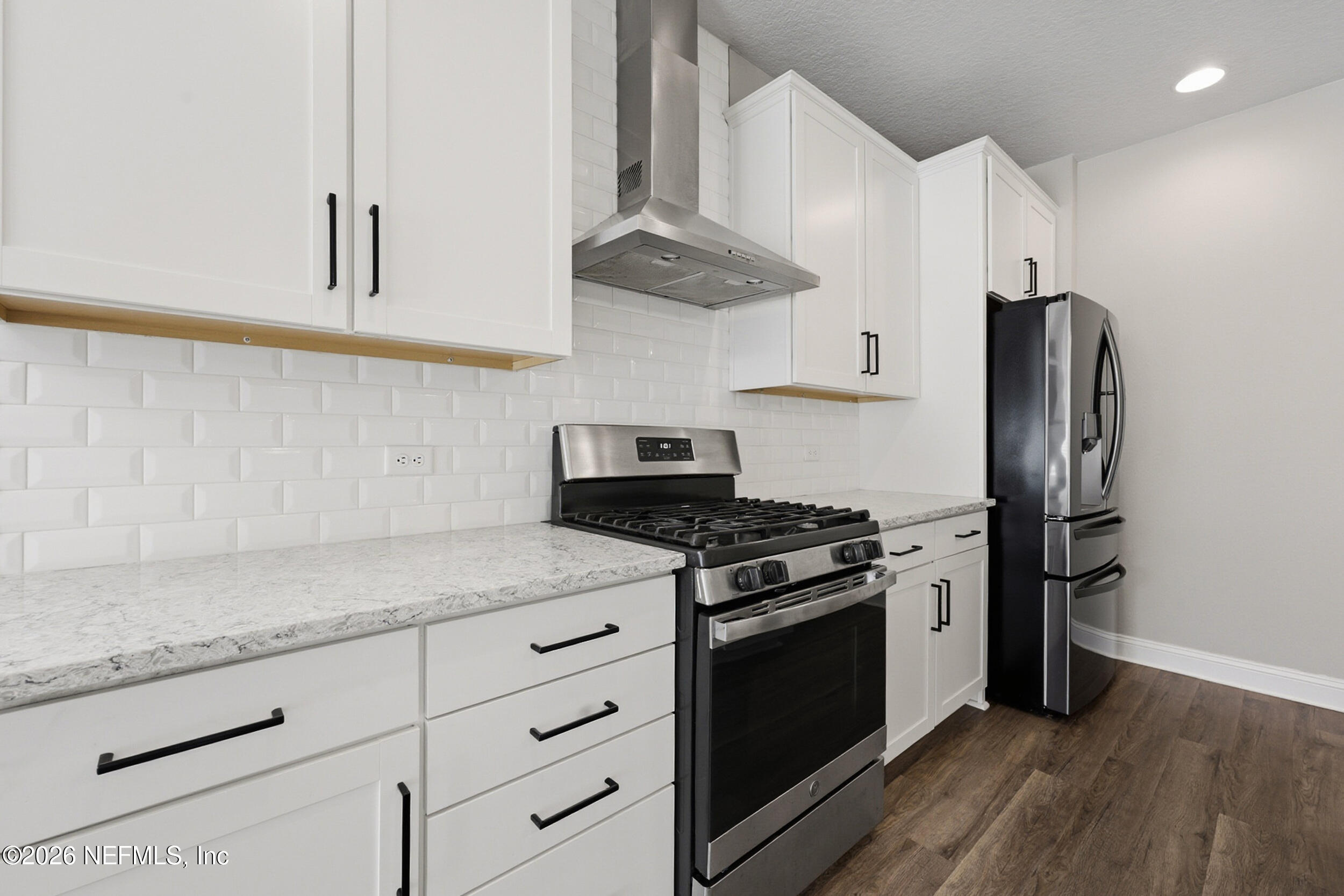 214 Pepperpike Way St. Augustine, FL 32092 - Photo 25 of 63 a kitchen with stainless steel appliances granite countertop a stove a refrigerator and a granite counter tops