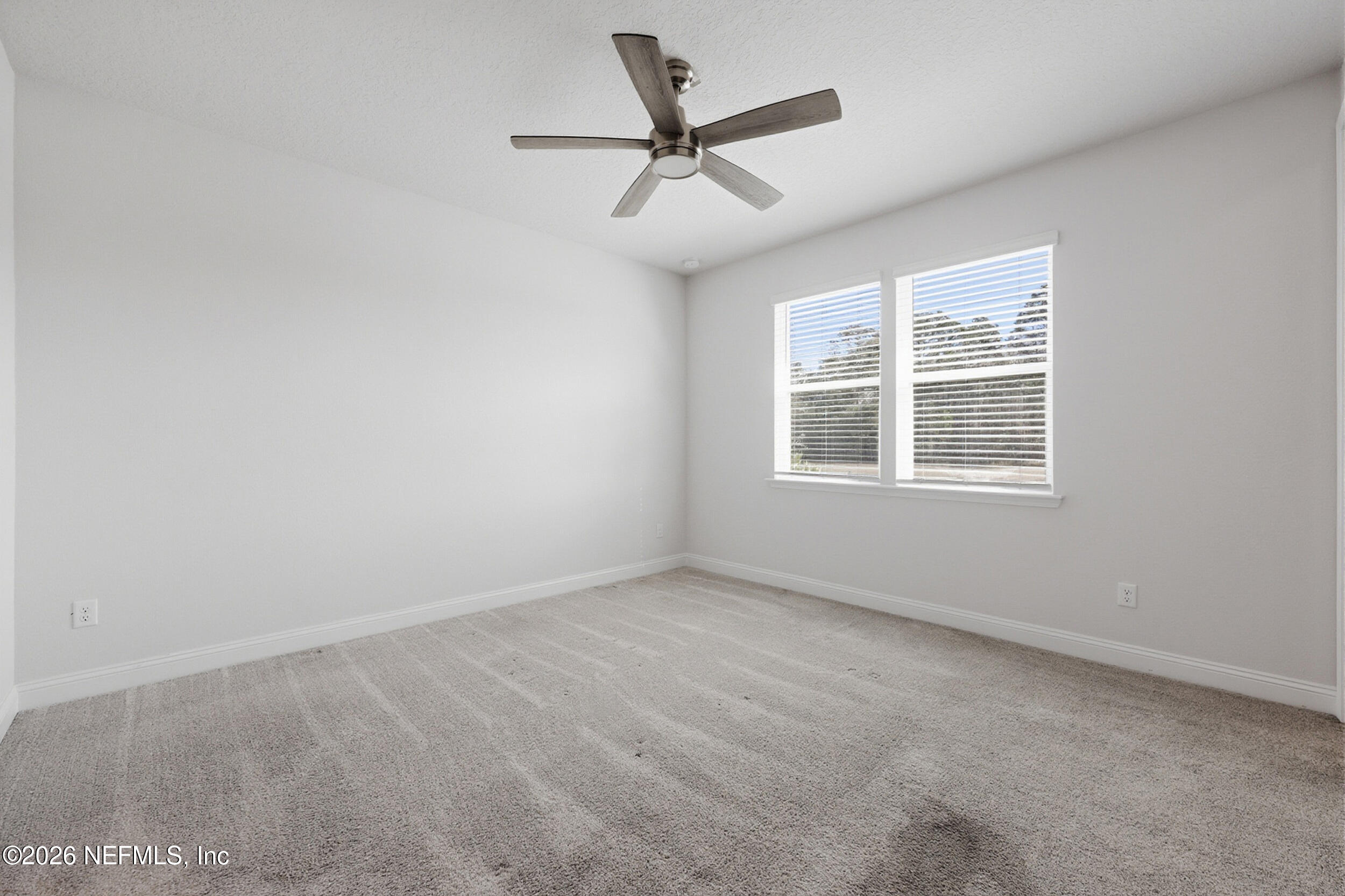 214 Pepperpike Way St. Augustine, FL 32092 - Photo 30 of 63 a view of an empty room with a window