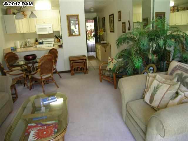 2531 South Kihei Road, Unit C211 Kihei, HI 96753 - Photo 1 of 12 a living room with furniture and wooden floor