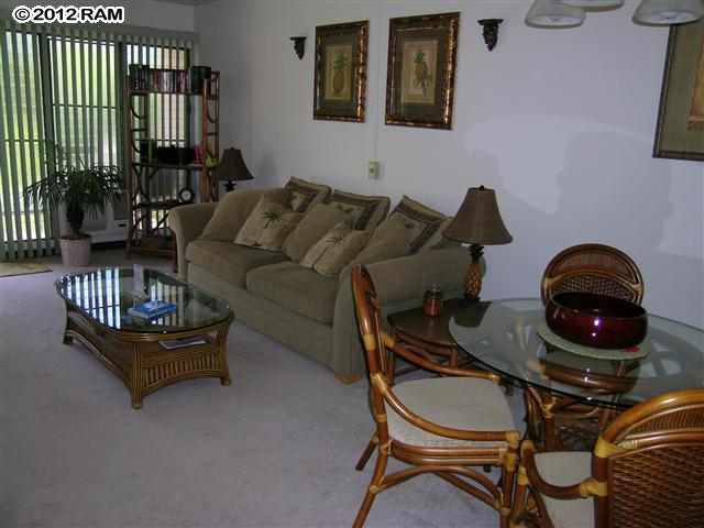 2531 South Kihei Road, Unit C211 Kihei, HI 96753 - Photo 3 of 12 a living room with furniture and a wooden floor