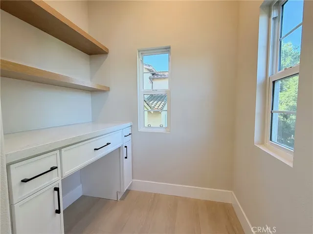 a view of cabinets and window
