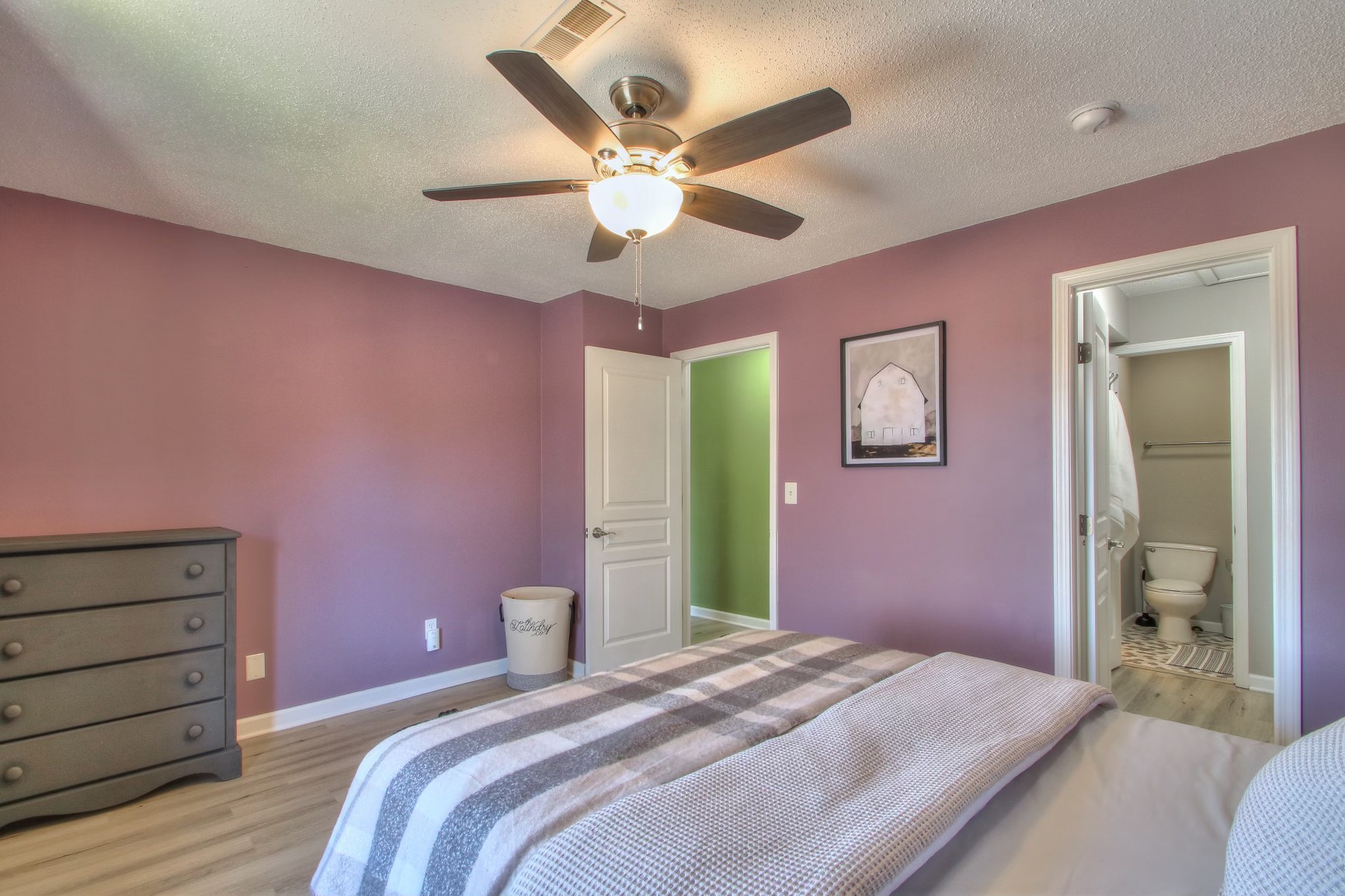 500 Paragon Mills Road, Unit N15 Nashville, TN 37211 - Photo 11 of 20 a bedroom with a bed and a chandelier