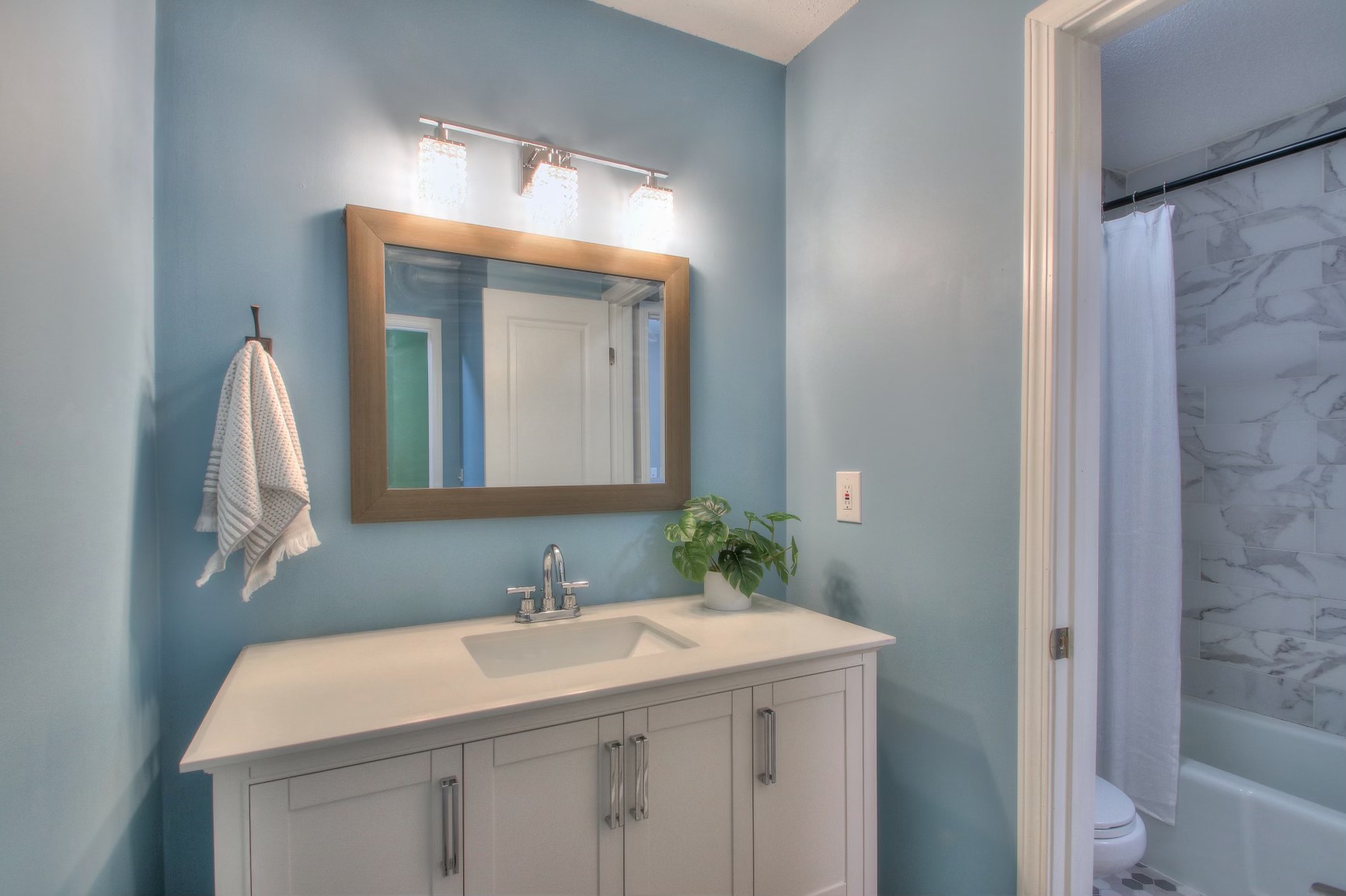 500 Paragon Mills Road, Unit N15 Nashville, TN 37211 - Photo 14 of 20 a bathroom with a sink vanity and a mirror