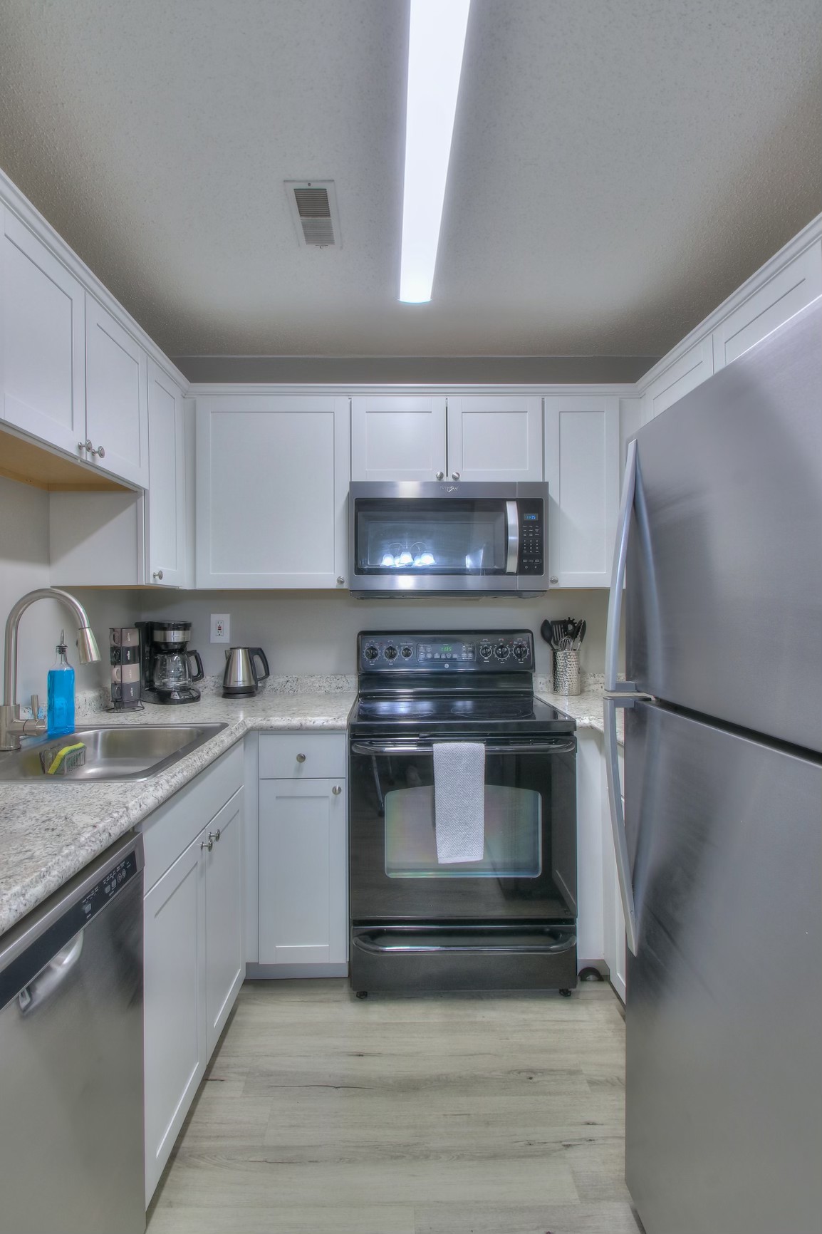 500 Paragon Mills Road, Unit N15 Nashville, TN 37211 - Photo 7 of 20 a kitchen with a refrigerator and a sink