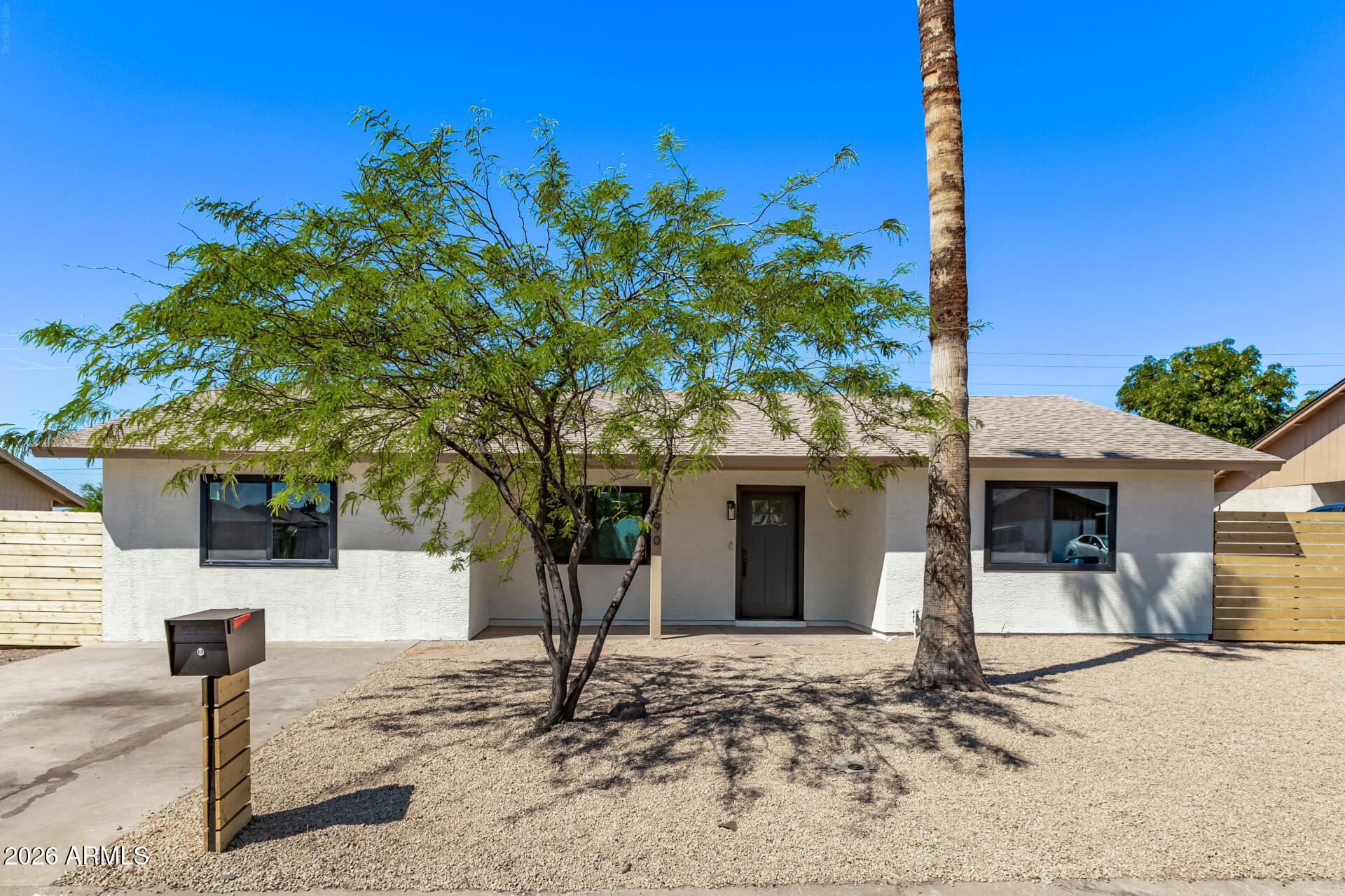2890 South Mariposa Road Apache Junction, AZ 85119 - Photo 1 of 27 a front view of a house with a yard and garage