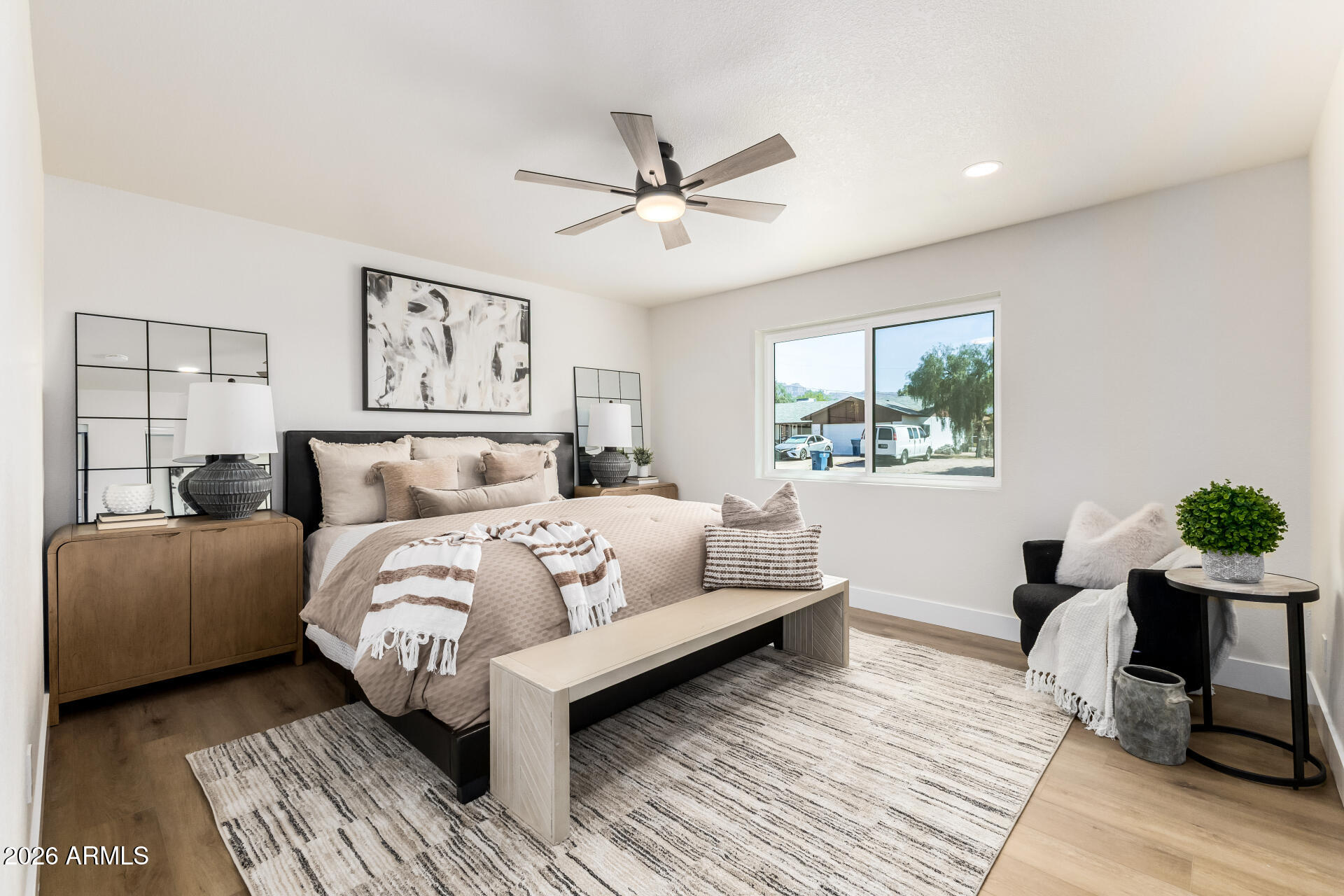 2890 South Mariposa Road Apache Junction, AZ 85119 - Photo 12 of 27 a bedroom with a bed and a potted plant