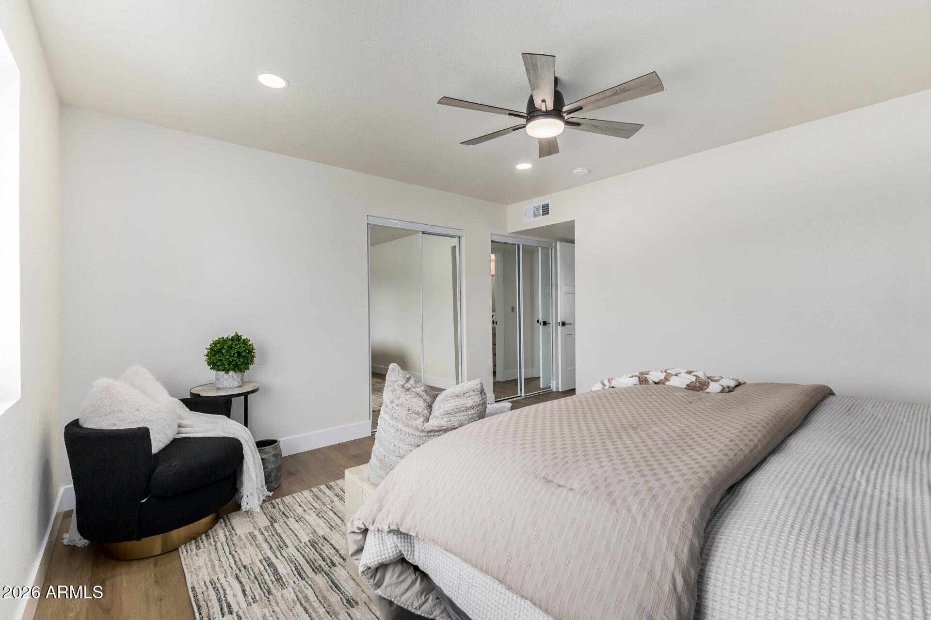 2890 South Mariposa Road Apache Junction, AZ 85119 - Photo 13 of 27 a bedroom with a bed and ceiling fan