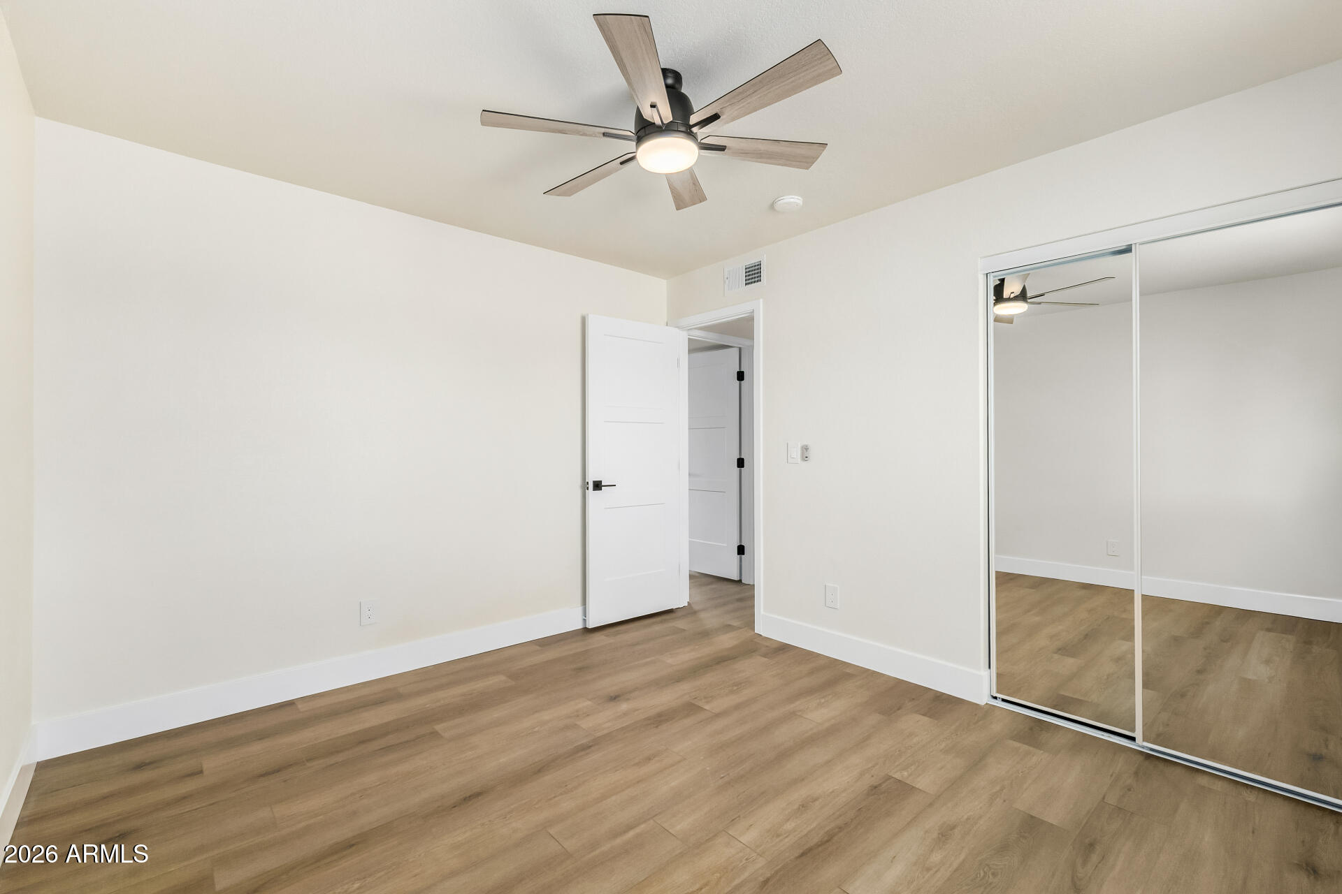 2890 South Mariposa Road Apache Junction, AZ 85119 - Photo 20 of 27 wooden floor in an empty room