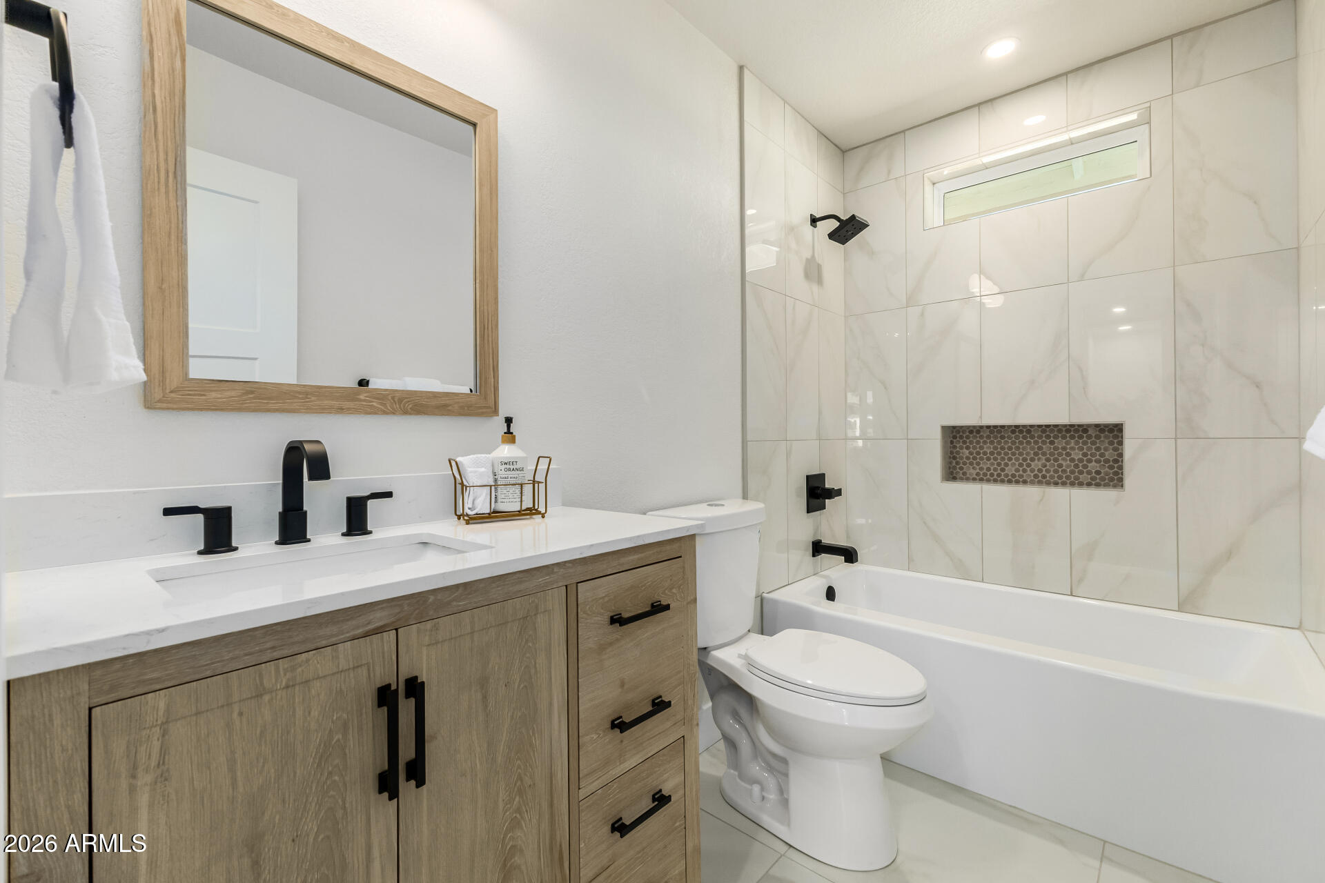 2890 South Mariposa Road Apache Junction, AZ 85119 - Photo 21 of 27 a bathroom with a granite countertop sink toilet a mirror and shower