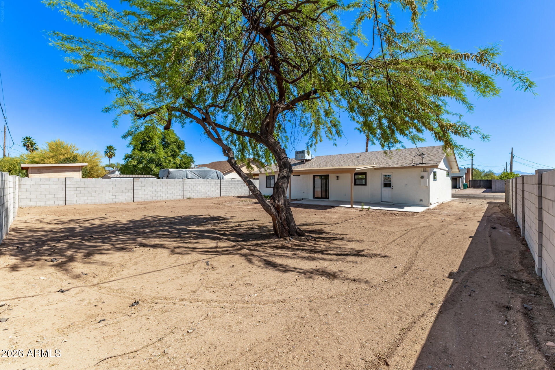 2890 South Mariposa Road Apache Junction, AZ 85119 - Photo 26 of 27 a view of a house with a tree in front of it