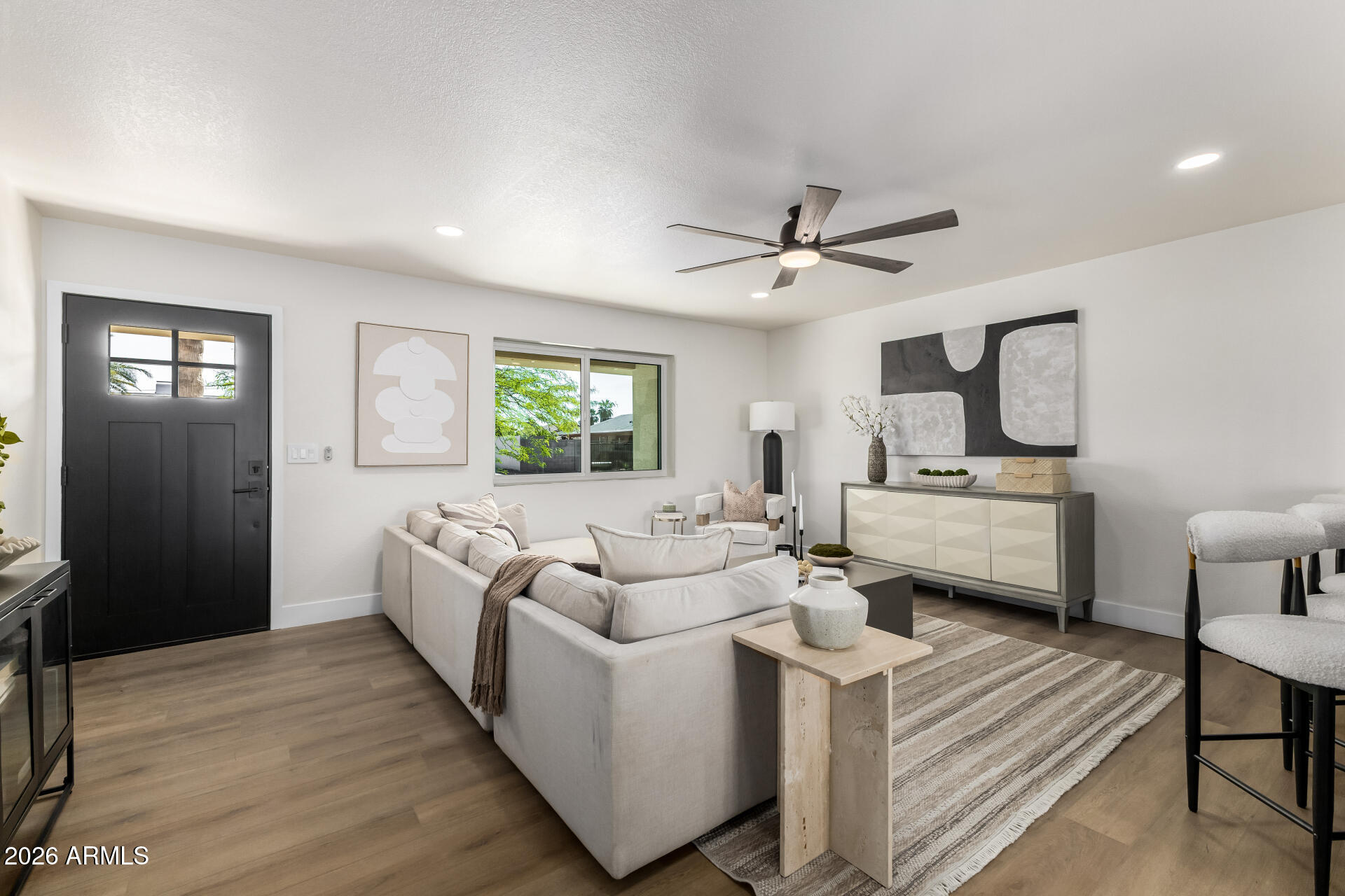 2890 South Mariposa Road Apache Junction, AZ 85119 - Photo 4 of 27 a living room with furniture and a wooden floor