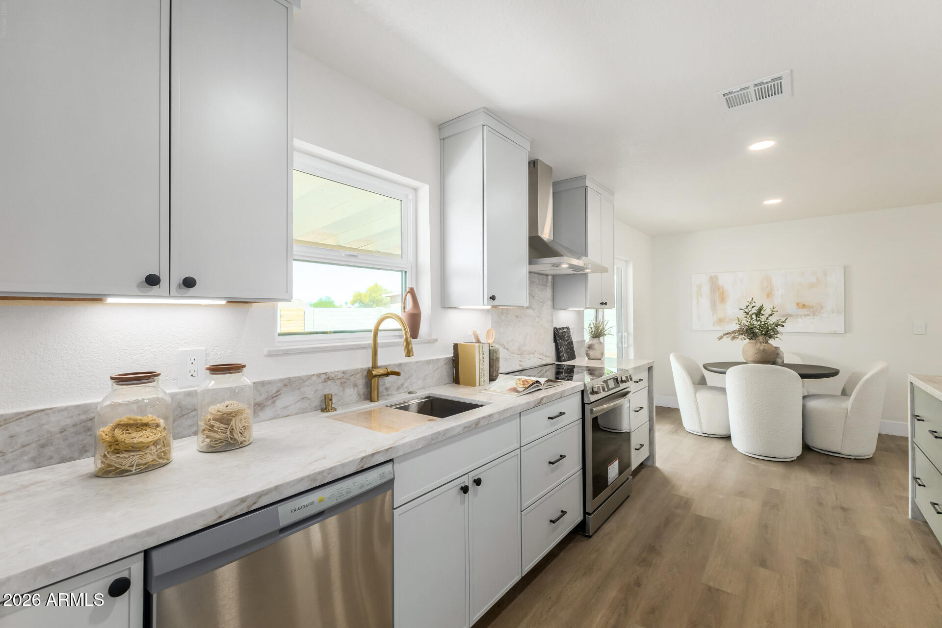 2890 South Mariposa Road Apache Junction, AZ 85119 - Photo 9 of 27 a kitchen with a sink stove and cabinets