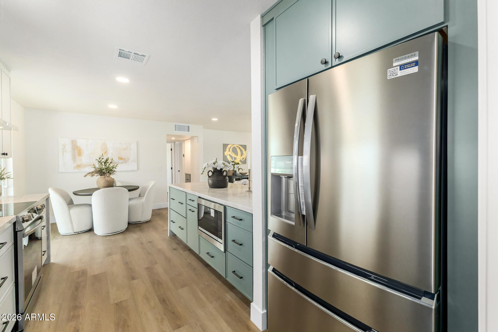 2890 South Mariposa Road Apache Junction, AZ 85119 - Photo 10 of 27 a kitchen with kitchen island a counter top space a sink stainless steel appliances and cabinets