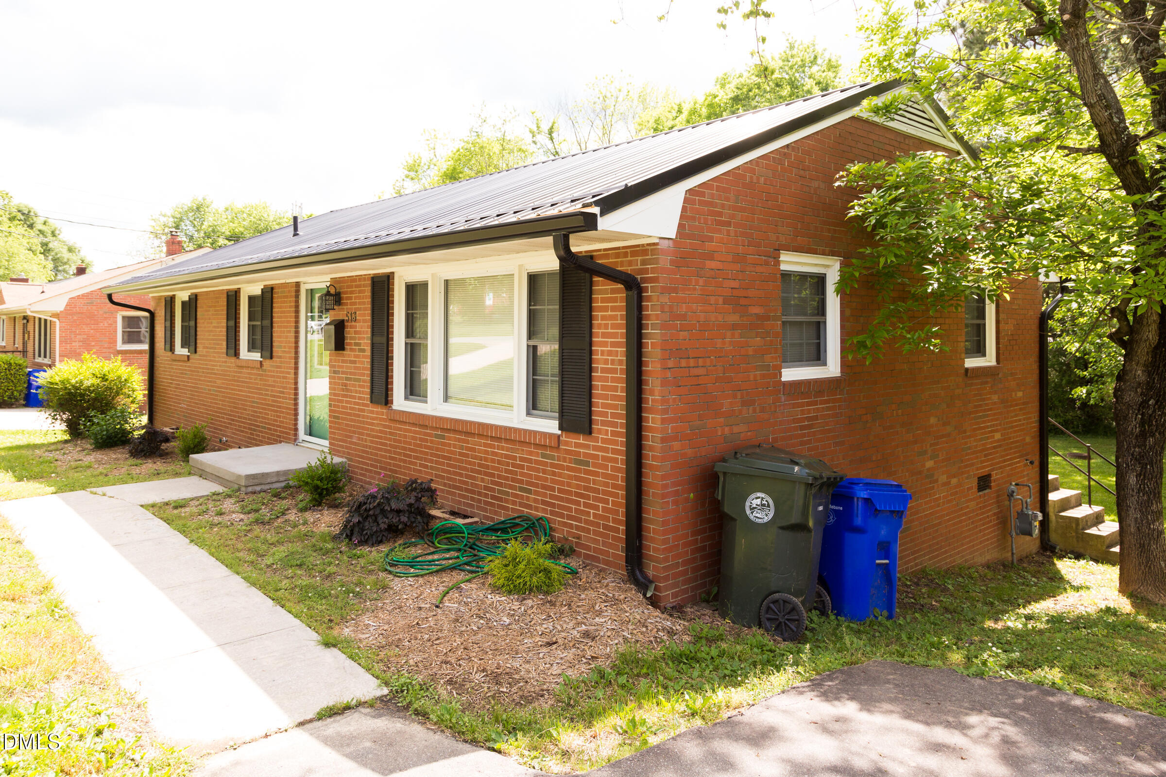 513 North 5th Street Mebane, NC 27302 - Photo 3 of 17 a front view of a house with garden