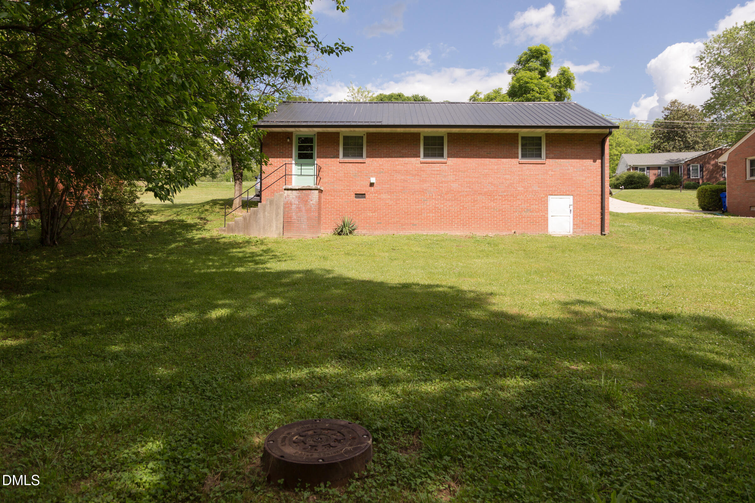 513 North 5th Street Mebane, NC 27302 - Photo 4 of 17 a front view of a house with a yard
