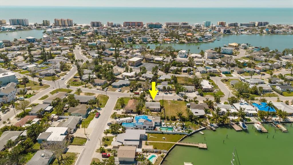 14031 East Parsley Drive Madeira Beach, FL 33708 - Photo 11 of 14 an aerial view of residential building with outdoor space