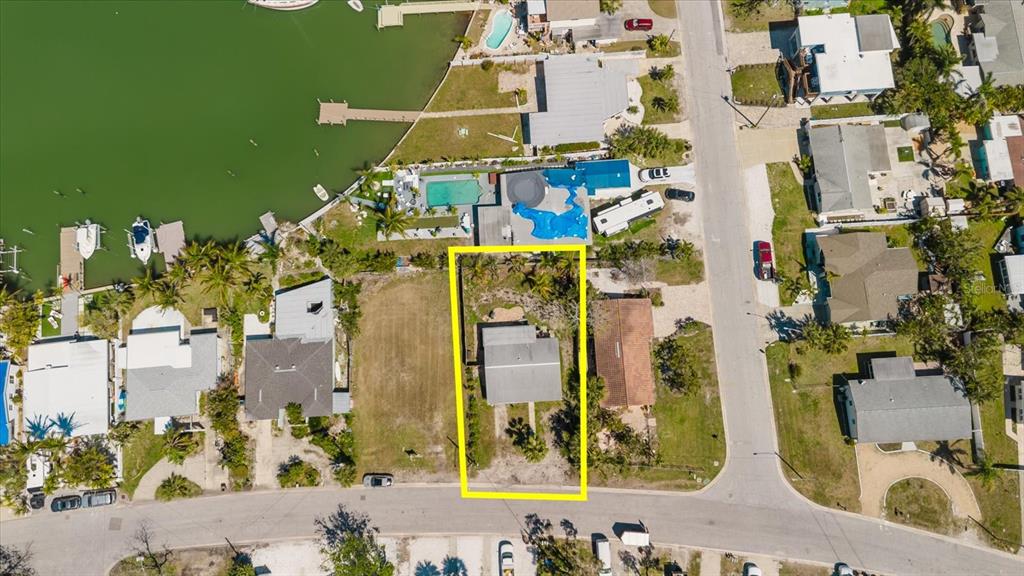 14031 East Parsley Drive Madeira Beach, FL 33708 - Photo 13 of 14 aerial view of a house with a swimming pool