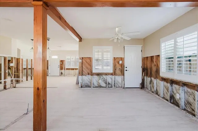 a view of a kitchen with furniture and a ceiling fan