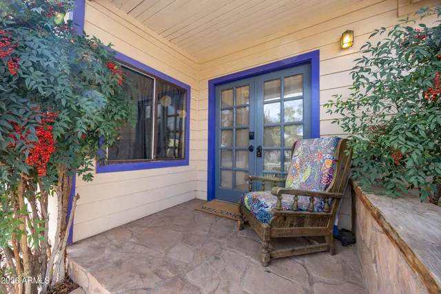 a wooden bench sitting in front of a building