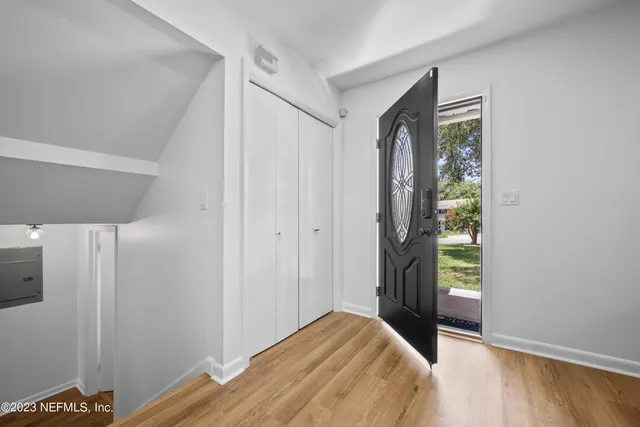 a living room with fireplace furniture and a flat screen tv