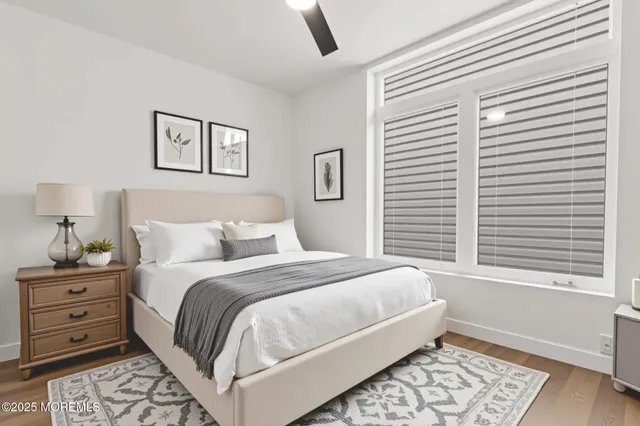 a bedroom with a large bed and a window