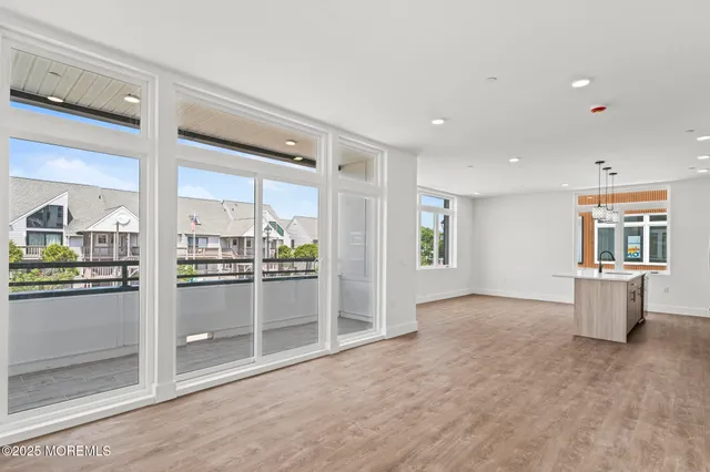 a view of a kitchen with furniture and an open kitchen