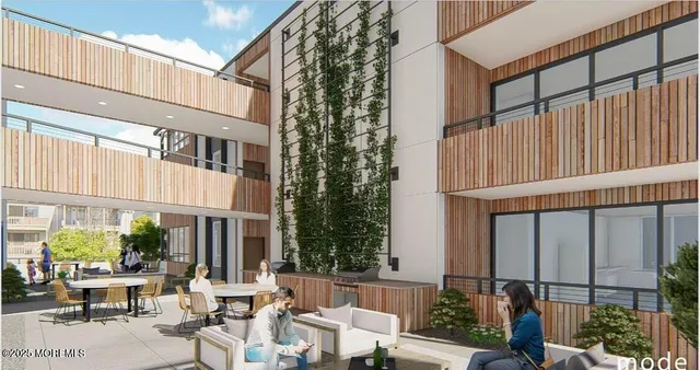 a view of a building with sitting area