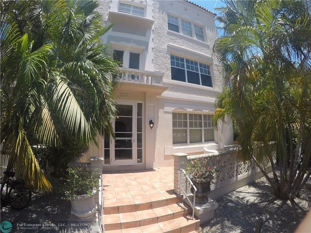 1611 Michigan Avenue, Unit 2 Miami Beach, FL 33139 - Photo 2 of 15 a view of a house with a yard and potted plants
