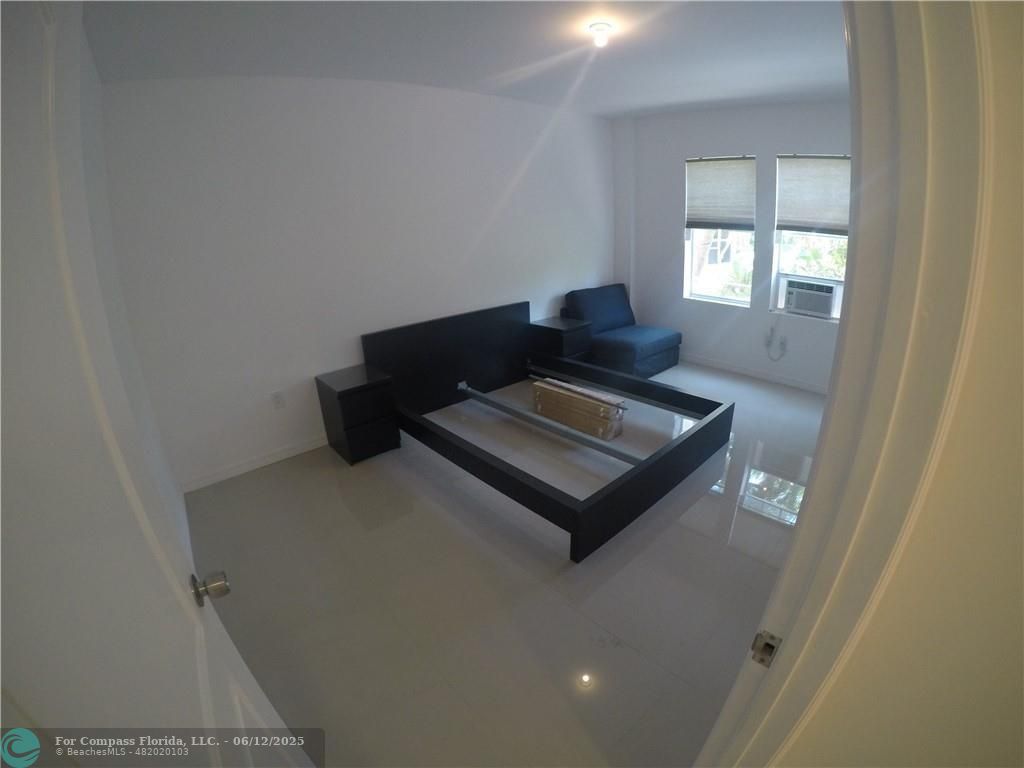 1611 Michigan Avenue, Unit 2 Miami Beach, FL 33139 - Photo 7 of 15 a living room with furniture and window