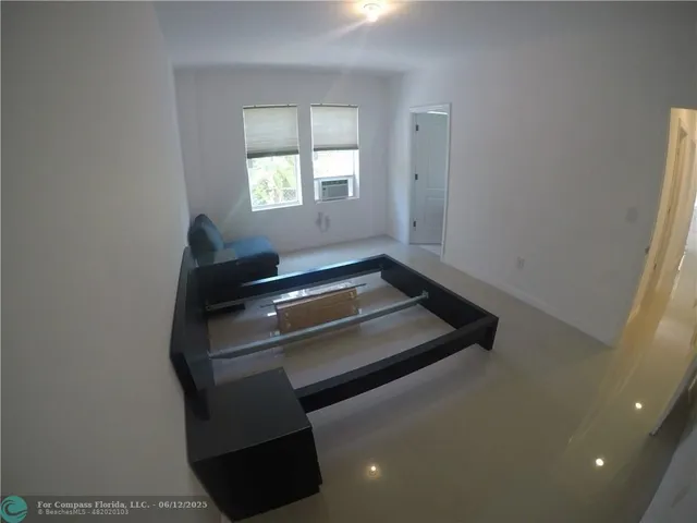 a bathroom with a toilet sink and shower