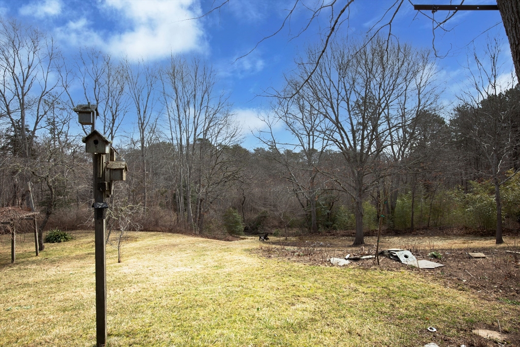 36 Lovell's Lane Mashpee, MA 02649 - Photo 20 of 23 a view of a backyard of the house